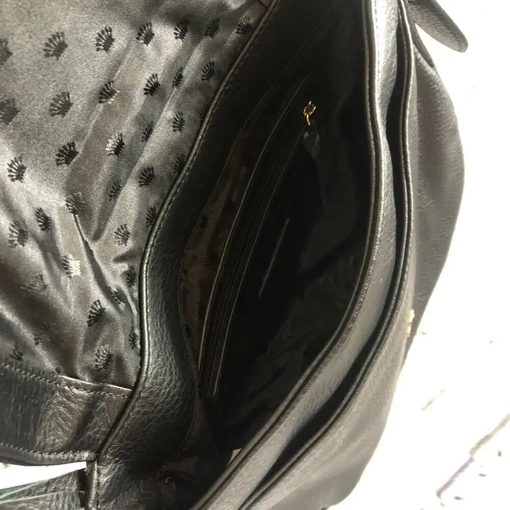 Juicy Couture shoulder crossbody bag in black with Gold embellishments.